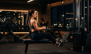 European Female Seated Cable Row GYM Workout Wallpaper