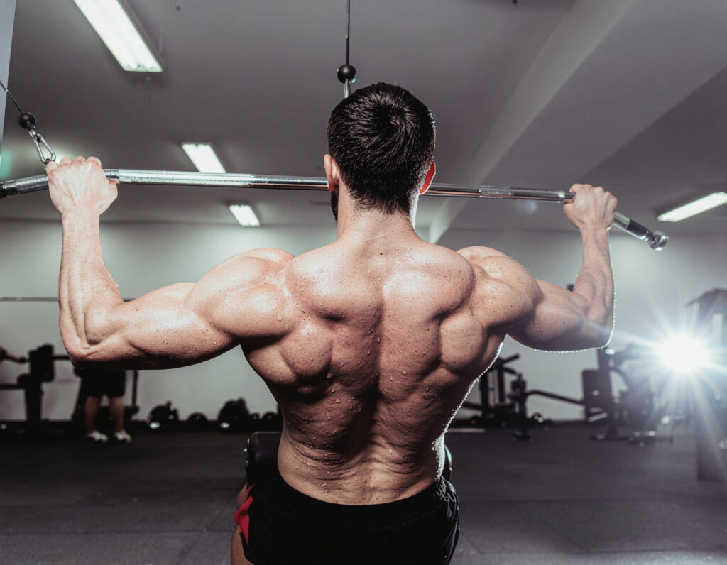 Muscular Male let Pulldown GYM Workout Wallpaper